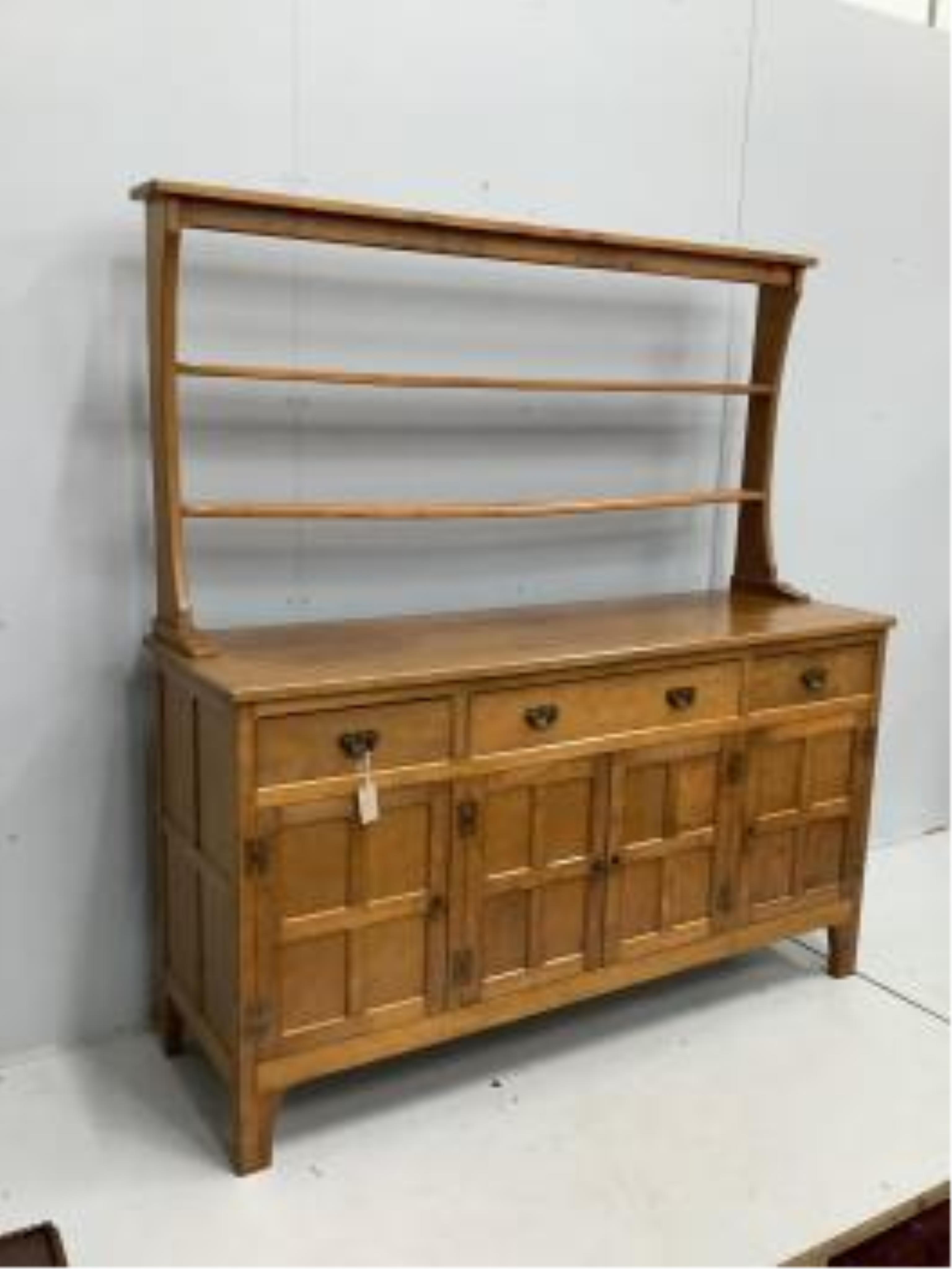 Alan Grainger 'Acorn Man', a mid century adzed oak dresser with open plate rack, width 160cm, depth 48cm, height 170cm. Condition - good